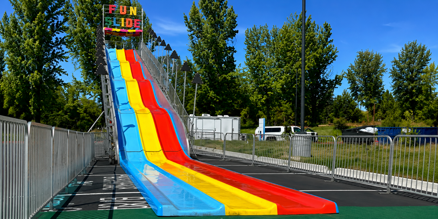 Why Carnival Rides and Super Fun Slides Are a Winning Combination for Large Events